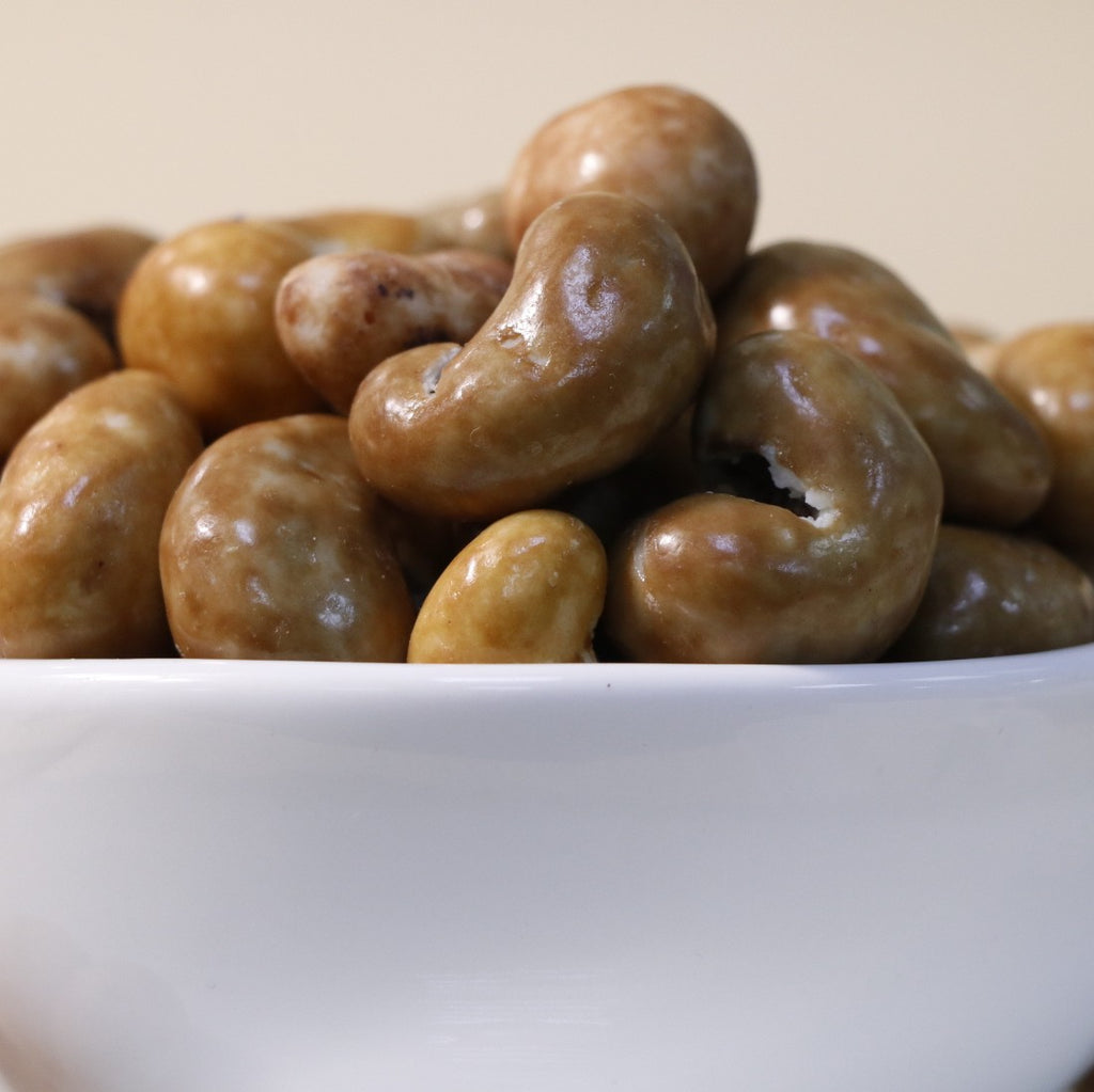 Yathrib Gourmet Caramel Cashew Dragee featuring caramel-coated cashews in a glossy, crunchy treat.