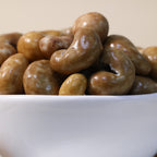 Yathrib Gourmet Caramel Cashew Dragee featuring caramel-coated cashews in a glossy, crunchy treat.