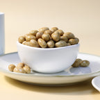 Yathrib caramel pistachio dragee with glossy caramel coating and crunchy pistachio nuts on the surface