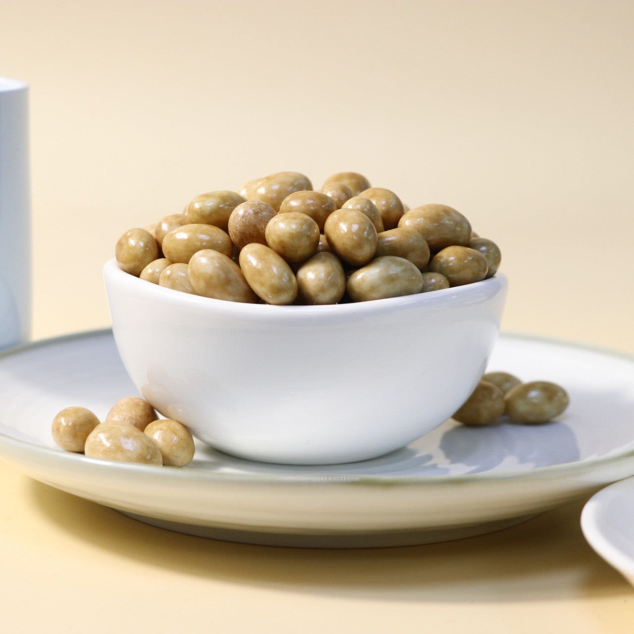 Yathrib caramel pistachio dragee with glossy caramel coating and crunchy pistachio nuts on the surface