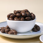Yathrib Classic Chocolate Cashew Dragee close-up showing glossy chocolate coating and crunchy cashew nuts inside.