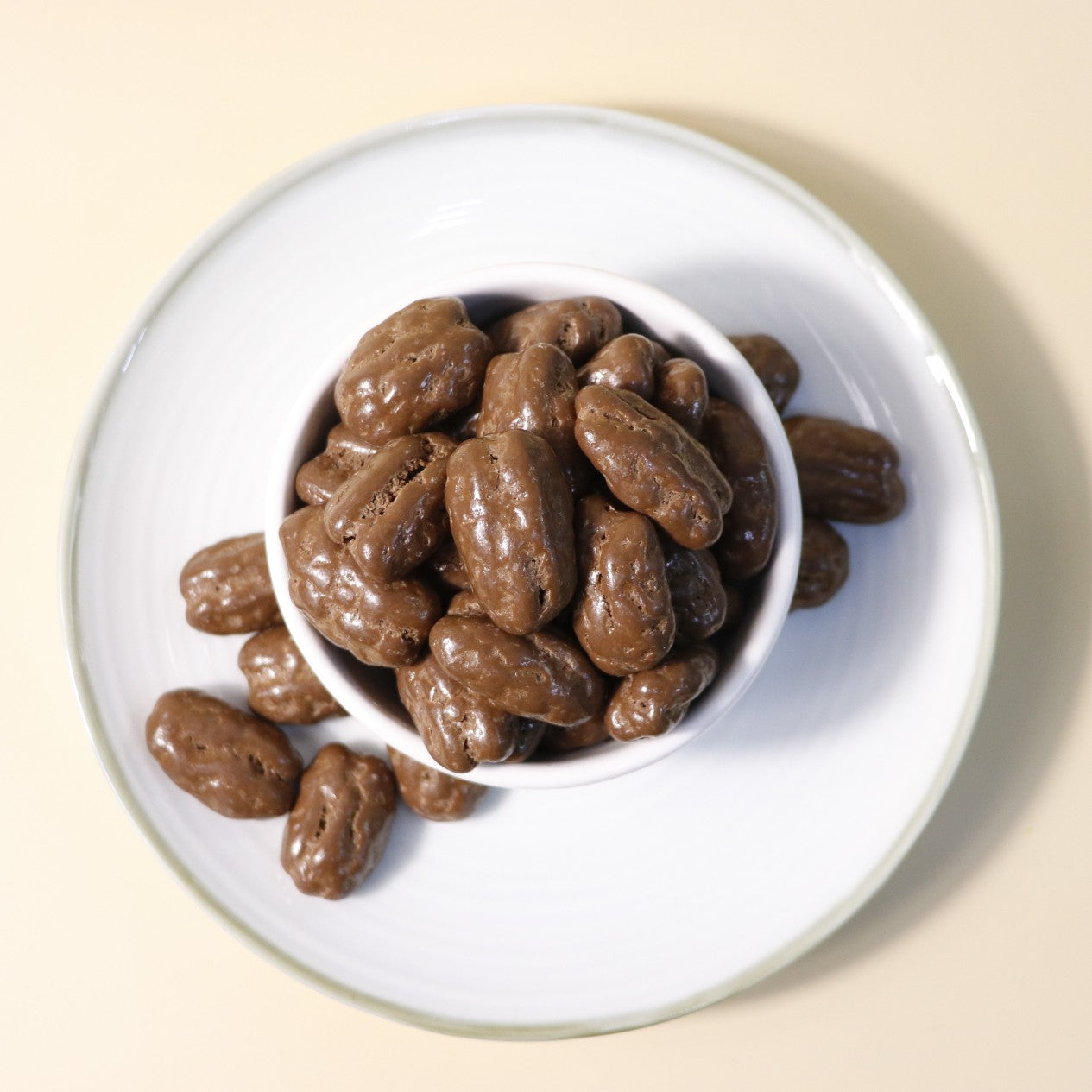 Yathrib Rich Chocolate Pecan Dragee showing glossy chocolate-covered pecans, detailed close-up of the sweet confection.