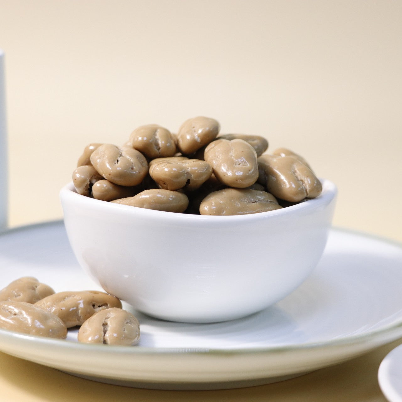 Yathrib Coffee Pecan Dragee featuring glazed pecans coated in coffee-flavored candy, displayed in a clear box.