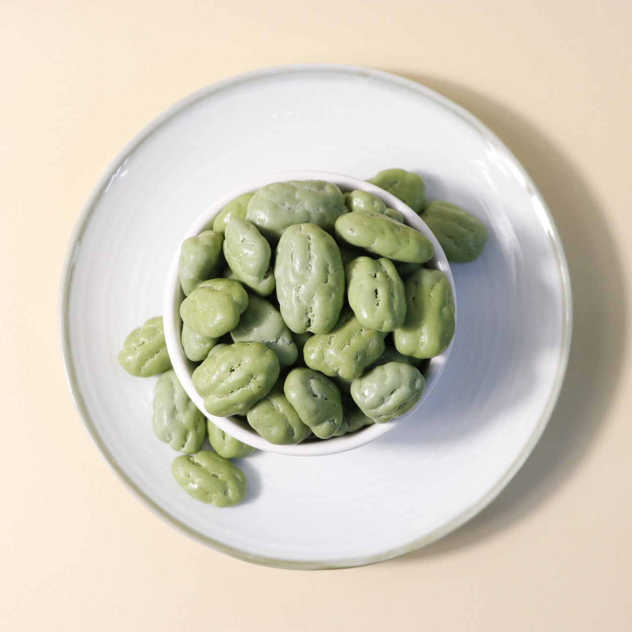 Yathrib Premium Matcha Pecan Dragee with green matcha coating and pecan nut filling, displayed on a white background.