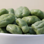 Yathrib Premium Matcha Pecan Dragee showing glossy coated pecan nuts with green matcha-flavored candy coating on a white background
