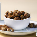Yathrib Classic Milk Chocolate Cashew Dragee showing shiny milk chocolate coating and whole cashews inside.