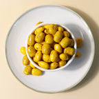 Yathrib Saffron Almond Biscuit Dragee showing golden-brown biscuits with almond pieces and saffron decoration on top.
