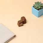 Yathrib Mandorica almond chocolate bar with visible almonds and smooth chocolate coating on the front.